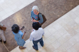 school administrators talking in hall